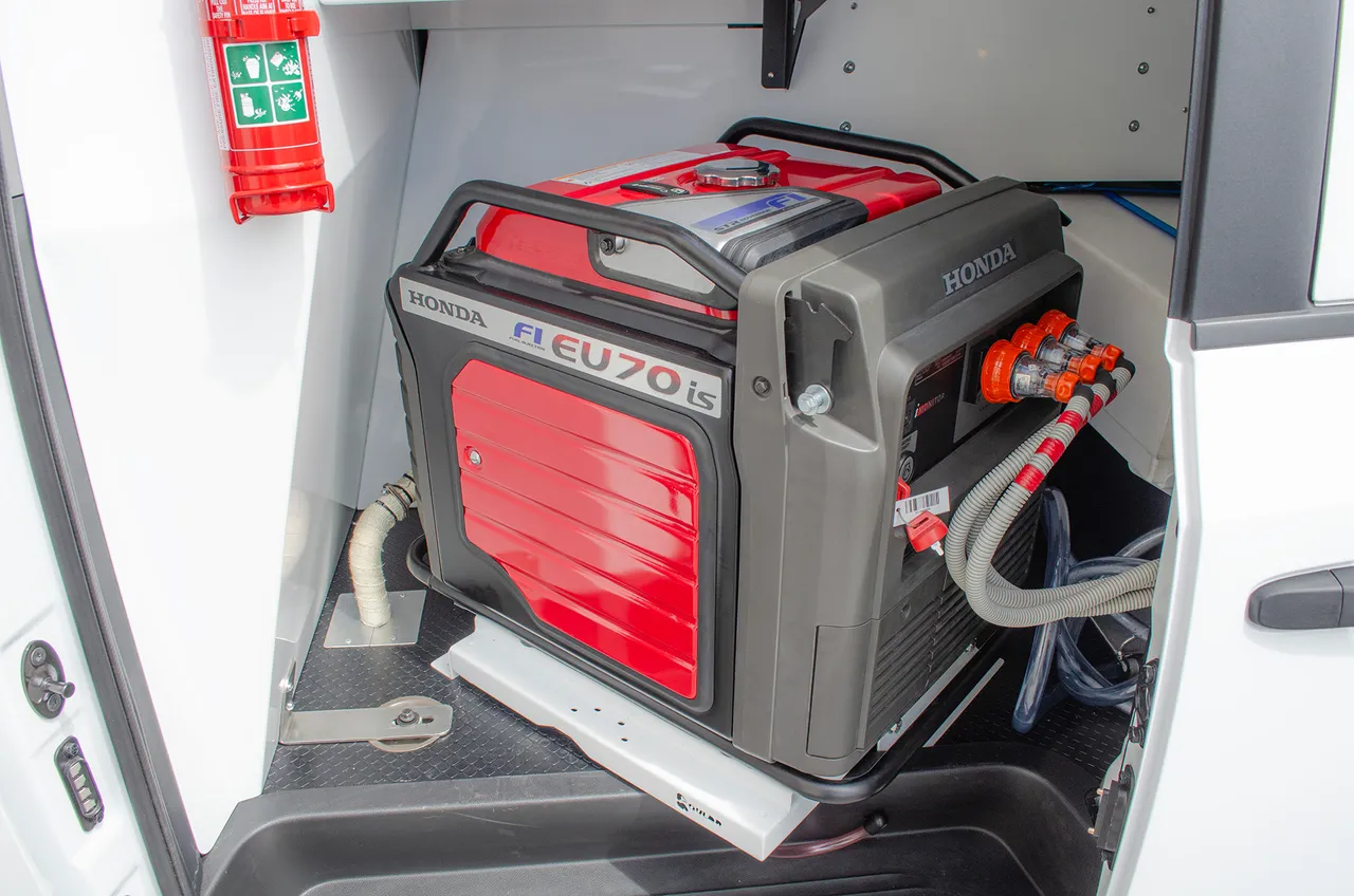 Honda EU70is generator bay with anchored mounting & extinguisher