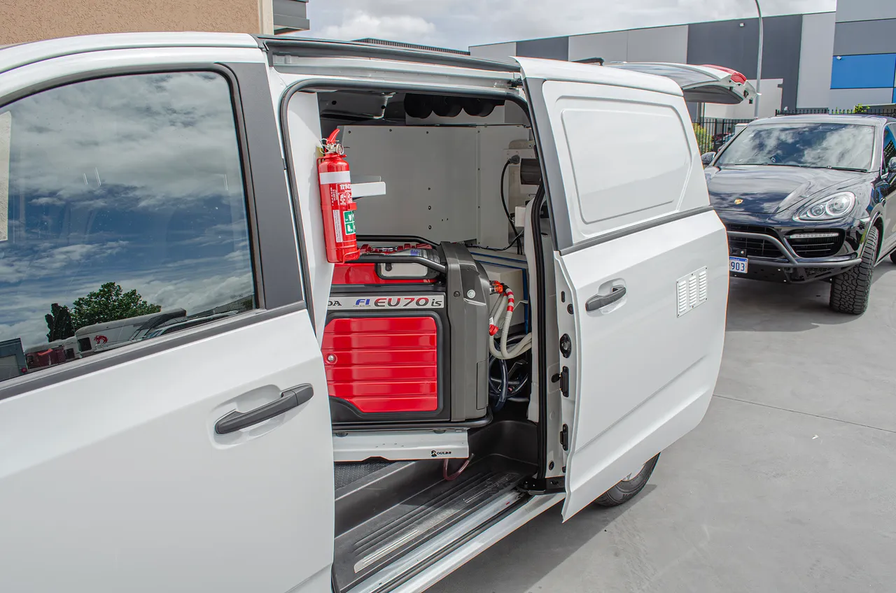 Side door access to generator and service bay